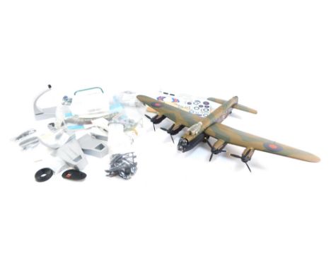 A diecast model of a Lancaster, with accessories and stand, with Royal Lancaster badge.