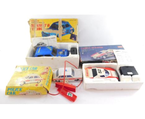 Remote controlled cars and rally cars, comprising a Schuco Radiograph Lancia Stratus 1:18 scale, with remote control, a Radio