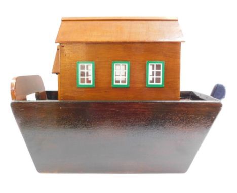 A wooden Noah's Ark model, containing various animals. 