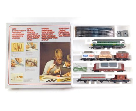 A Lima part train set, comprising diesel locomotive, trucks, brake van and various track, in partial box. 