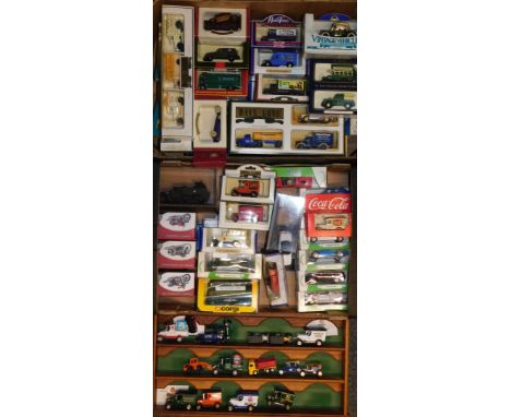 A group of die cast cars and vehicles, Coca Cola bus, Harley Davidson motorbikes, vintage classics, Mobil Days Gone and other