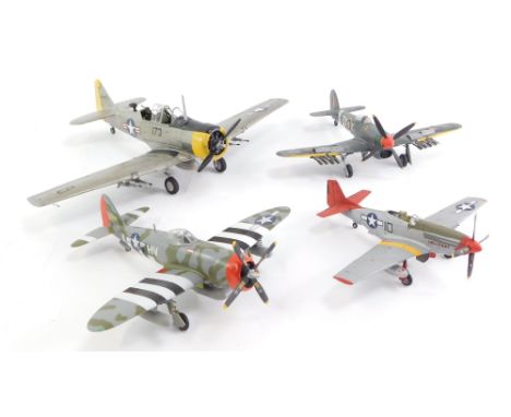 Four built and painted model aircraft, including a Spitfire, and three USAAF planes. 