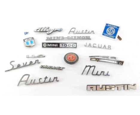 A group of British car badges, to include the Mini 1000, Austin 7, the Allegro MG red enamel badge, the Mini Minor, British L