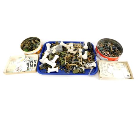A group of painted plastic army figures. (3 tins) 