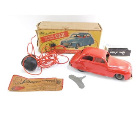 A Chad Valley clock work remote control car, boxed.