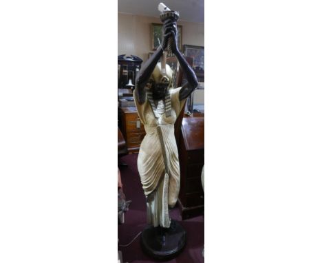 A large fibreglass standard lamp in the form of a pharaoh, lacking glass shade, H.180cm 