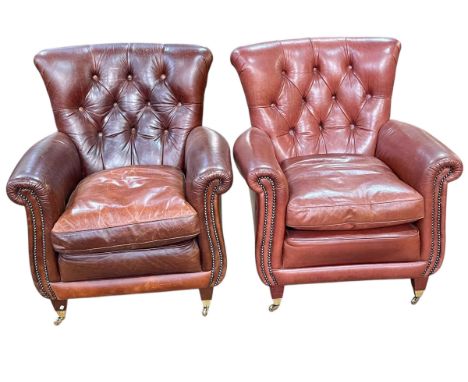 Pair brown button backed leather and brass studded armchairs.