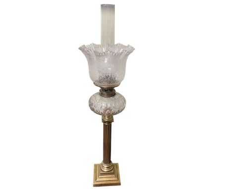 Victorian brass columned oil lamp with etched glass shade, 76cm high.