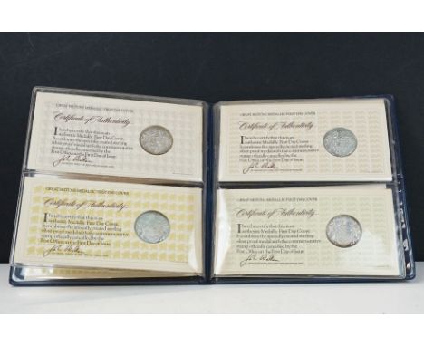 A set of four sterling silver Medallic first day coin covers within a fitted collectors album 