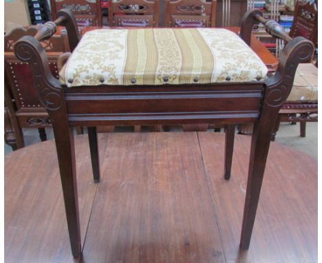 An Edwardian mahogany piano stool on square tapering legs