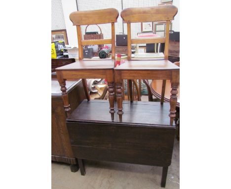 A 19th century oak gate leg dining table together with two dining chairs