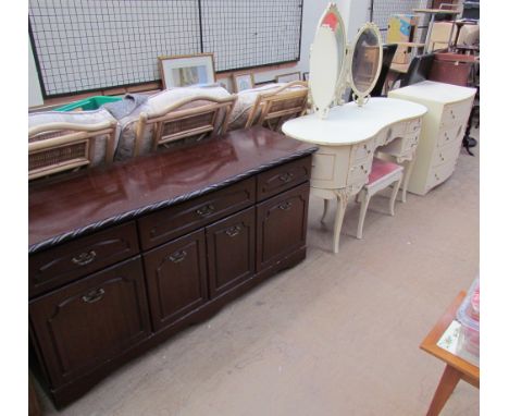 A reproduction mahogany sideboard together with a cream dressing table, dressing table stool and matching chest of drawers 