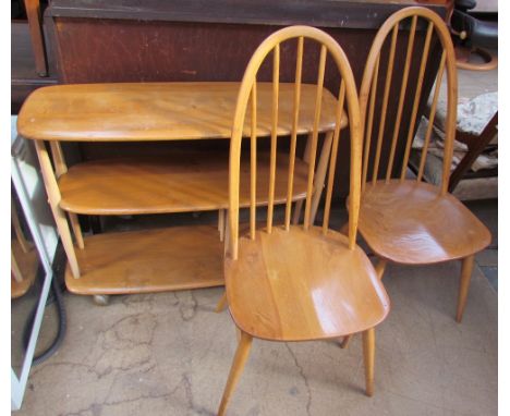 An Ercol three tier shelf unit on wheels together with a pair of Ercol dining chairs