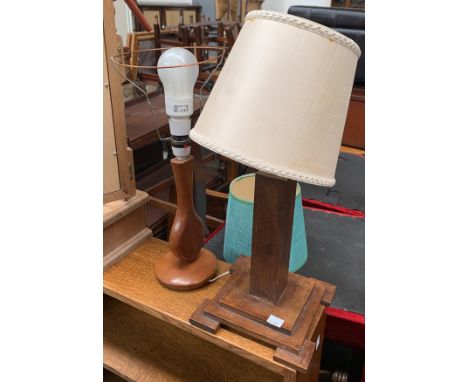 An Art Deco style wooden table lamp, on stepped square base; together with one other 