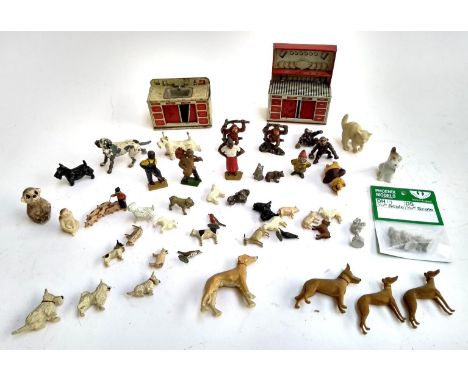 A mixed lot to include cast metal animals, model train figures, possibly a Forest Toys wooden lurcher, tin plate oven etc