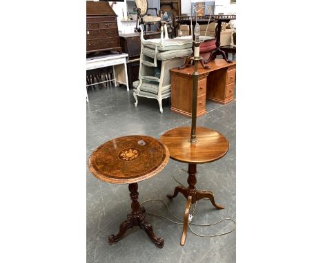 A brushed metal standard lamp raised on a tripod table; together with one other burr walnut veneer tripod table of recent man