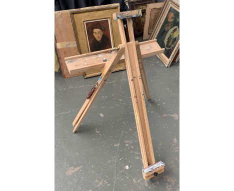 A beechwood folding artists easel with brush shelf 