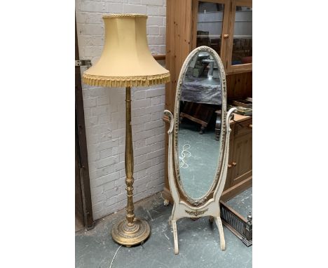 A giltwood standard lamp with shade, 166cmH; together with a white painted oval cheval mirror, 148cmH 