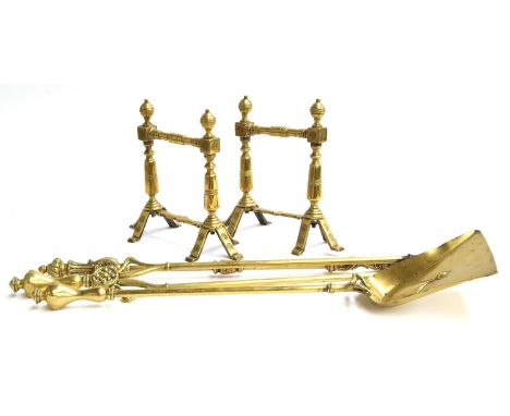 A pair of Arts &amp; Crafts style brass firedogs, in the manner of Christopher Dresser, each 25.5cm high; together with simil