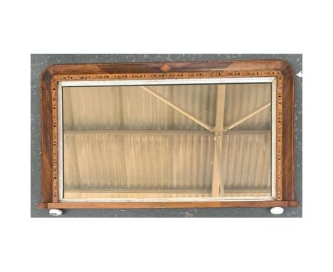 A mahogany and parquetry over mantel mirror, with silvered slip on ceramic bun feet, 84x49cm