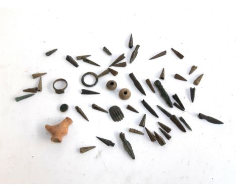 A quantity of detector finds to include medieval ring, flint arrow heads, terracotta chicken etc 