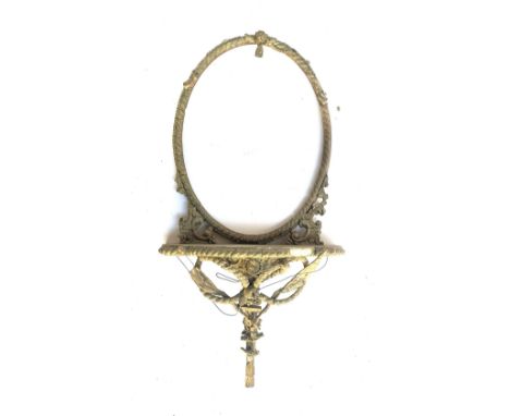 A oval gilt gesso Louis XV mirror frame and shelf, with nautical motifs (af), approx. 75cmH 