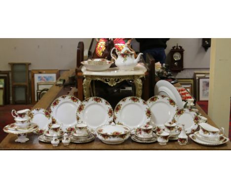 A Royal Albert tea and dinner service decorated in the old country roses design, approximately fifty pieces.