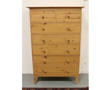 A pine two over five chest of drawers raised on bracket feet.