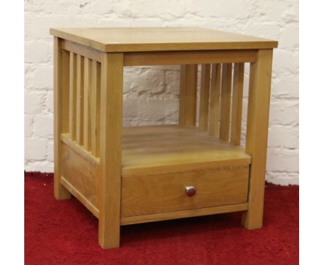 A light oak two tier occasional table with drawer.