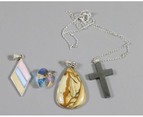 Four pendants to include a cross and a silver and enamel example.