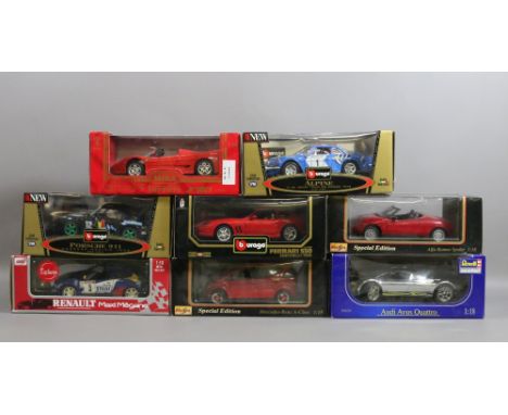 A collection of boxed scale models of cars including Burago and Maisto. 