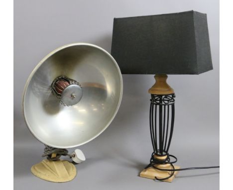 A modern tablelamp along with a vintage heat lamp.