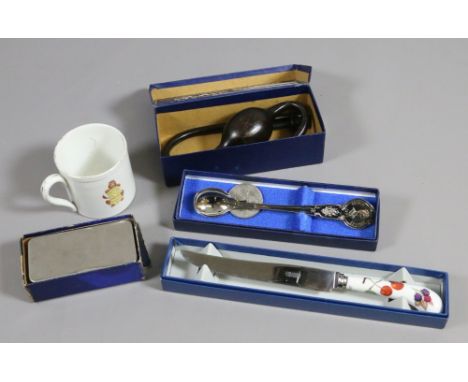 A commemorative mug, coin and spoon along with two medical instruments and a Royal Worcester spoon.