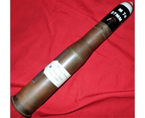 Painted enamel projectile, with brass body, dated 1942.&nbsp;