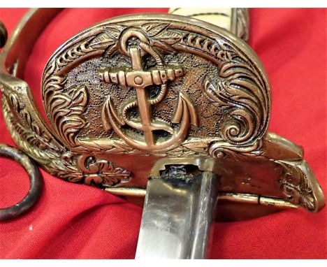 All-brass ornate backstrap, D-shaped guard, fouled anchor folding langet &amp; lion’s head pommel. Ivorine grip with full wir