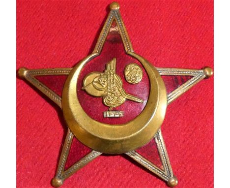 Very good red enamel finish, very small hairline cracks to two arms, but no obvious damage. Some white frosting to brass bord