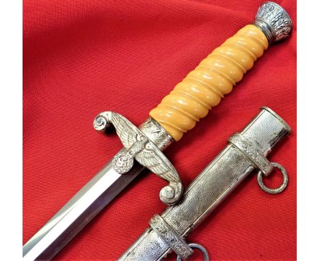 Features very good condition silver washed nickel fittings, with yellow grip and eagle cross guard. Unmarked 25.8 cm long ver