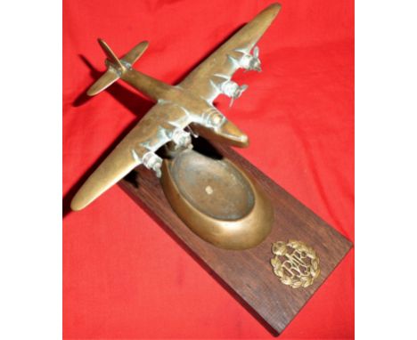 WW2-era Sunderland flying boat ashtray trench art piece. Brass example, with RAF badge to wooden base, with some missing prop