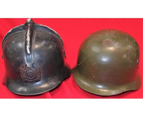 Auxiliary helmet, black-finished steel body, with cruciform comb to crown, retaining auxiliary services badge to front, rear 
