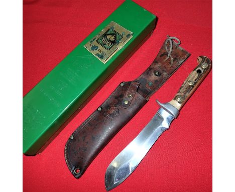 Stag grips, with nickel fittings, being numbered 86581 to inside of guard. 15 cm long bowie-type ‘White Hunter’ blade, retain