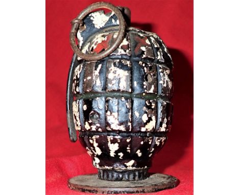Retains pull ring, lever, screw-in base plate &amp; stand stamped RBD 7/41. Remains of black &amp; white enamel to body. 10 c