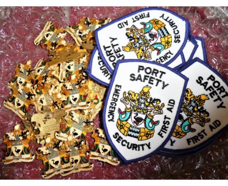 Includes 9 Port Security patches &amp; 32 F.P.A. gilt &amp; enamel cap badges, by Sheridan - 11 with lugs.