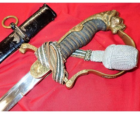 All-brass ornate backstrap, P-shaped guard, crossed cannon langet &amp; lion’s head pommel, retaining both ruby-set stone eye