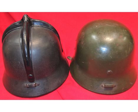 Auxiliary helmet, black-finished steel body, with cruciform comb to crown, rear attachment clip &amp; full leather liner asse