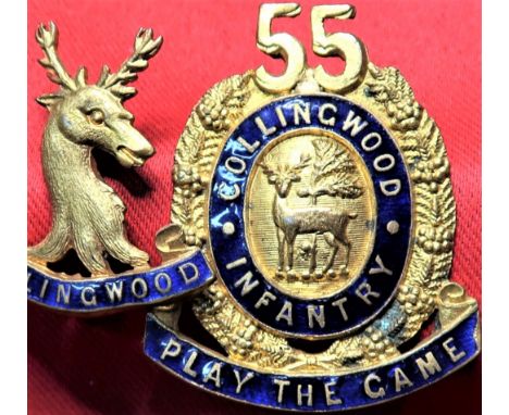 Gilt-fired finished, with enamel scrolls. Very small chip to extreme edge of right scroll of cap badge. Loops to rear. Scarce