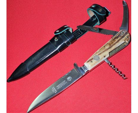 Stag grips, with nickel fittings, with combination cork screw, &amp; 2 fold-out knives.11 cm long nickel blade. Original Waid