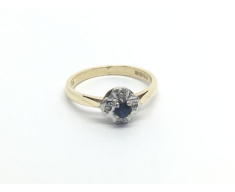 An 18carat gold sapphire and diamond cluster ring size J-K