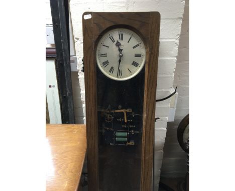 A oak case Synchronme electric slave clock .