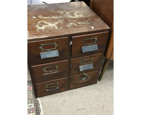 A Mahogany six flight of office type drawer each drawer containing tools.