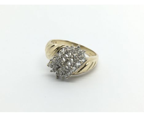 A 9carat gold ring set with a cluster of diamonds ring size Q.